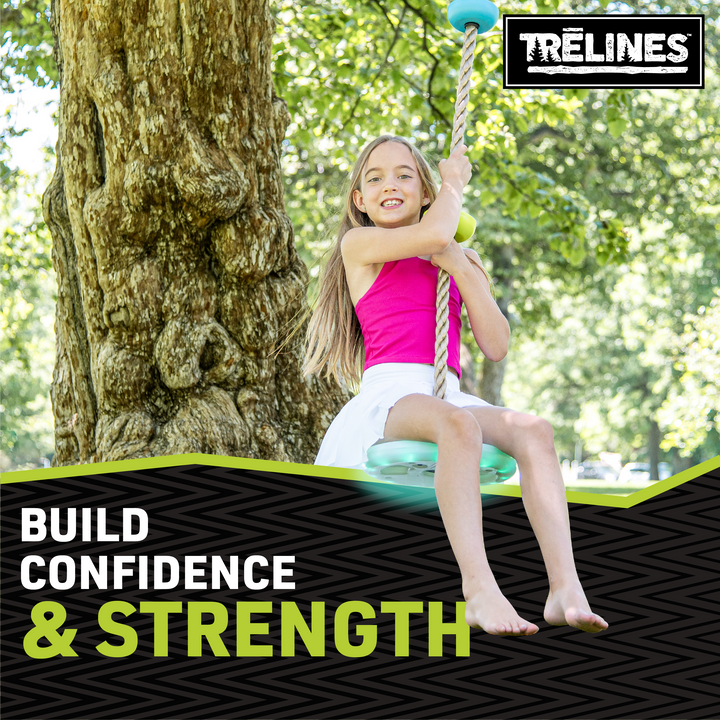 Child using LED climbing rope swing for outdoor ninja obstacle training